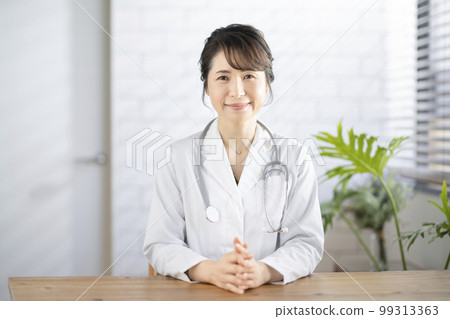 Smiling female doctor looking at camera 99313363