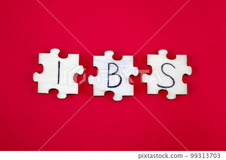 IBS Irritable Bowel Syndrome Acronym Written on Wooden Puzzles on a Red Background IBS Irritable Bowel Syndrome Acronym Written on Wooden Puzzles on a Red Background 99313703