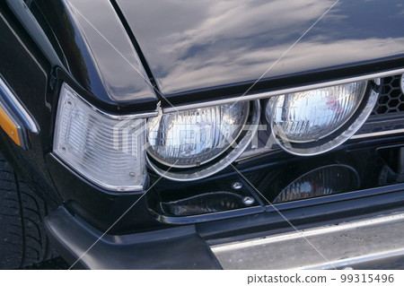Rare classic car headlight closeup 99315496