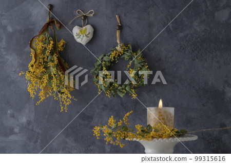 Mimosa flowers and candles 99315616