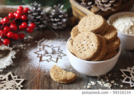 Homemade crispy oatmeal cookies. Rustic style, new year decoration 99316134