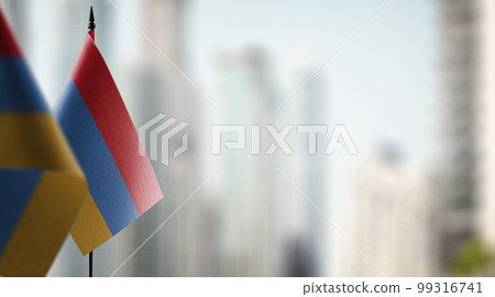 Small flags of the Armenia on an abstract blurry background 99316741