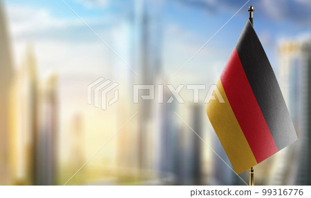 A small Germany flag on an abstract blurry background 99316776