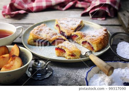 Homemade plum pie and cup of tea. New York Times recipe plum cake 99317090
