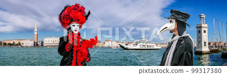 Colorful carnival masks with famous Plague Doctor at a traditional festival in Venice, Italy 99317380