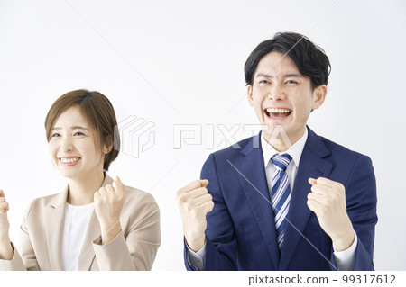 Business woman and businessman in a guts pose white background 99317612