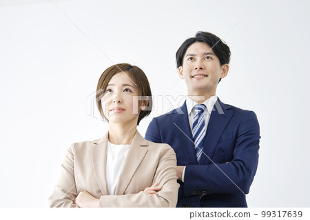 Portrait of a smiling business woman and businessman white background Portrait of a smiling business woman and businessman white background 99317639