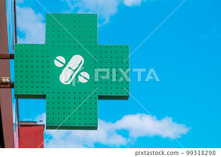 Pharmacy. Green pharmacy sign against the blue sky Pharmacy. Green pharmacy sign against the blue sky 99318298