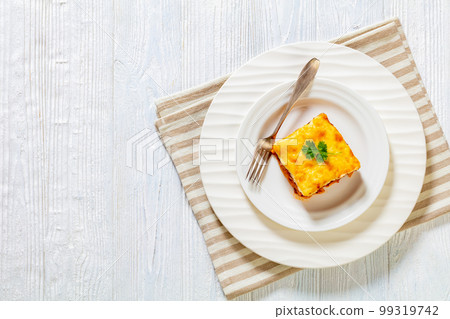 Greek Pastitsio on white plate, top view Greek Pastitsio on white plate, top view 99319742