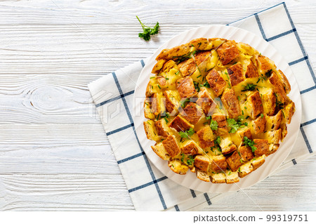 cheesy garlic bread, pull apart bread, top view 99319751