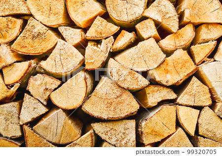 Firewood background. Preparation of firewood for the winter. Pile of firewood. Firewood background. Preparation of firewood for the winter. Pile of firewood. 99320705