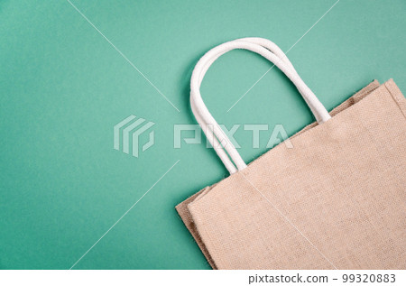 Textile eco friendly shopping bag. Zero waste concept. Plastic free concept. Top view, flat lay, copy space. Textile eco friendly shopping bag. Zero waste concept. Plastic free concept. Top view, flat lay, copy space. 99320883