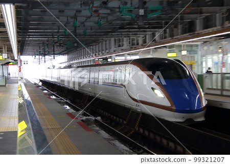 Hokuriku Shinkansen W7 series arriving at Itoigawa station in winter 99321207