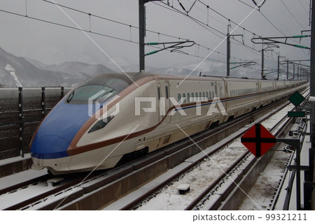 Hokuriku Shinkansen W7 series departing from Itoigawa station in winter Hokuriku Shinkansen W7 series departing from Itoigawa station in winter 99321211