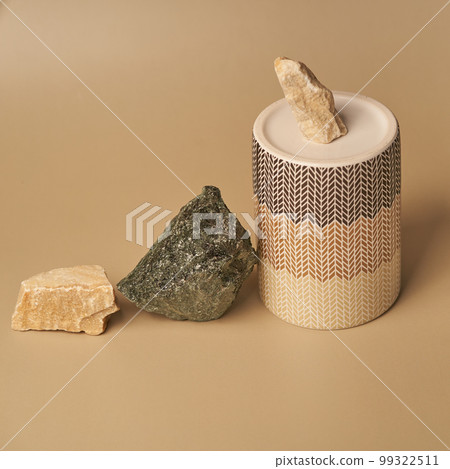 Beige and green stones and a ceramics podium on a beige background, natural product display mockup, pedestal for your product advertising. Hight quality photo 99322511