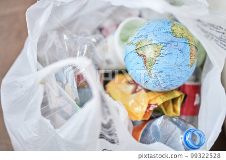The globe of the earth with plastic garbage on a white background, the concept of the problem of ecology and environment Day. A message for social advertising, with a place to copy. High quality photo The globe of the earth with plastic garbage on a white background, the concept of the problem of ecology and environment Day. A message for social advertising, with a place to copy. High quality photo 99322528