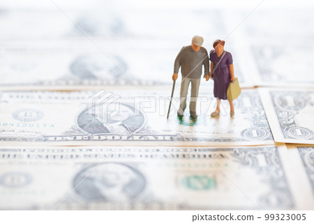 Old couple and dollar bill Money image after retirement Old couple and dollar bill Money image after retirement 99323005