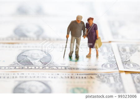 Old couple and dollar bill Money image after retirement Old couple and dollar bill Money image after retirement 99323006