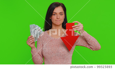 Upset woman showing red arrow pointing down, concept of downgrade bankruptcy money dollar fail, fall Upset woman showing red arrow pointing down, concept of downgrade bankruptcy money dollar fail, fall 99323893