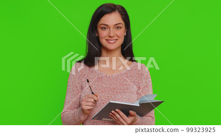 Thoughtful journalist woman making notes, writing down thoughts with pen into notepad notebook diary Thoughtful journalist woman making notes, writing down thoughts with pen into notepad notebook diary 99323925