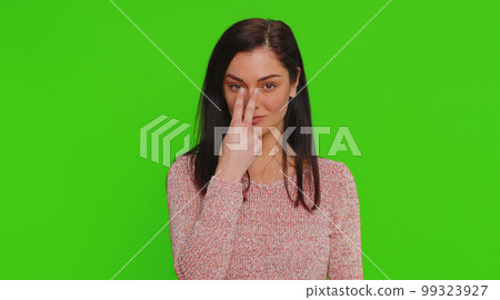 Serious woman pointing at her eyes show I am watching you gesture spying on someone guilty disbelief 99323927