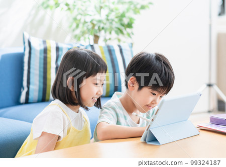 Elementary school student studying on a tablet Elementary school student studying on a tablet 99324187