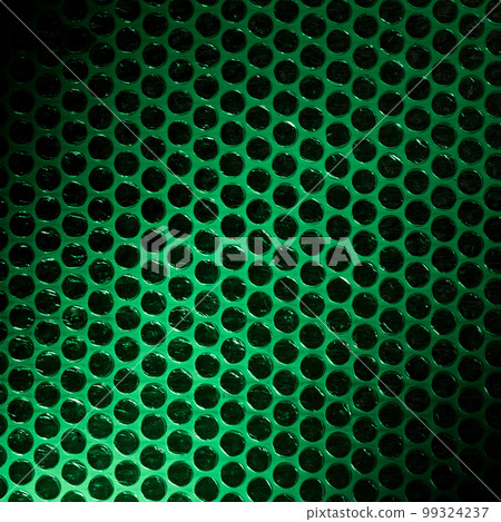 Bubble wrap lit by green light Bubble wrap lit by green light 99324237