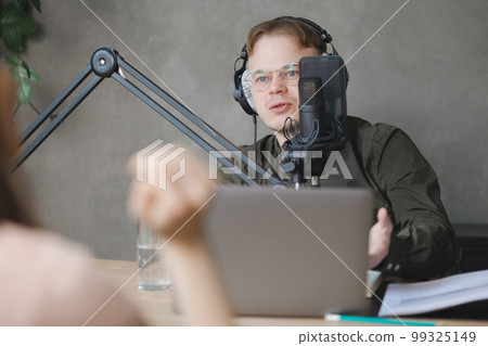 man and woman in studio record podcast, create audio content, advertising message 99325149