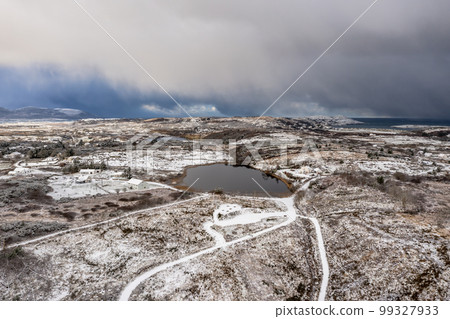 Aerial view of snow covered Bonny Glen Woods by Portnoo in County Donegal, Ireland. Aerial view of snow covered Bonny Glen Woods by Portnoo in County Donegal, Ireland. 99327933