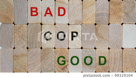 Wooden blocks with text 'bad cop, good cop'. Beautiful wooden background. Copy space. Wooden blocks with text 'bad cop, good cop'. Beautiful wooden background. Copy space. 99329104
