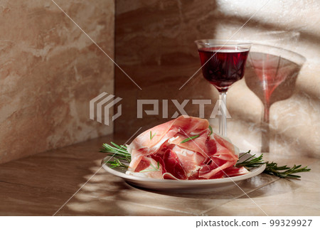 Prosciutto or Spanish jamon with rosemary and red wine. Prosciutto or Spanish jamon with rosemary and red wine. 99329927