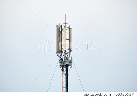 Wireless Communication Antenna Various GPS, cellphone, 3G, 4G and 5G equipped telecommunication tower on blue sky copy space background 99330537