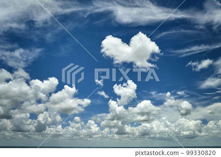 White puffy cumulus clouds on summer blue sky White puffy cumulus clouds on summer blue sky 99330820