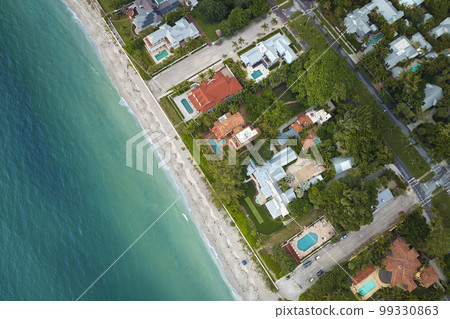 View from above of large residential houses in island small town Boca Grande on Gasparilla Island in southwest Florida. American dream homes as example of real estate development in US suburbs View from above of large residential houses in island small town Boca Grande on Gasparilla Island in southwest Florida. American dream homes as example of real estate development in US suburbs 99330863