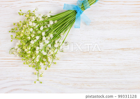 Bouquet of lilies of the valley flowers on old white wooden table. horizontal flat lay, top view. Bouquet of lilies of the valley flowers on old white wooden table. horizontal flat lay, top view. 99331128