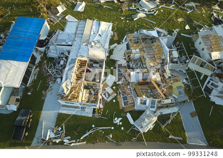 Severely damaged houses after hurricane Ian in Florida mobile home residential area. Consequences of natural disaster Severely damaged houses after hurricane Ian in Florida mobile home residential area. Consequences of natural disaster 99331248