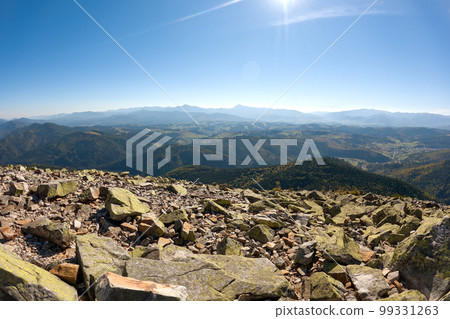 Rocky mountain hillside with big stone boulders on sunny day 99331263