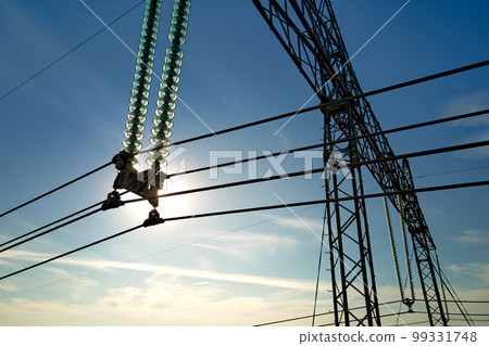 High voltage insulation string on steel pillar with electric power lines for safe delivering of electrical energy through cable wires on long distance High voltage insulation string on steel pillar with electric power lines for safe delivering of electrical energy through cable wires on long distance 99331748
