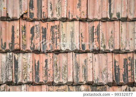 Closeup surface of old weathered ceramic tiles covering building roof 99332077