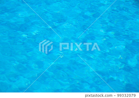 Closeup surface of blue clear water with small ripple waves in swimming pool. Closeup surface of blue clear water with small ripple waves in swimming pool. 99332079