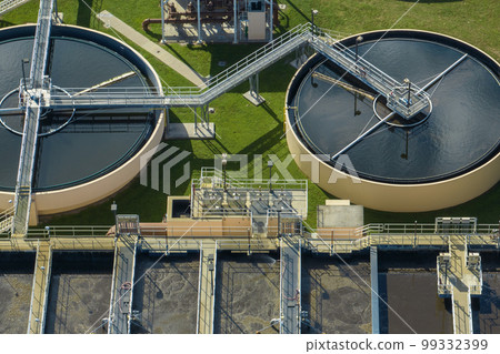 Aerial view of water treatment factory at city wastewater cleaning facility. Purification process of removing undesirable chemicals, suspended solids and gases from contaminated liquid Aerial view of water treatment factory at city wastewater cleaning facility. Purification process of removing undesirable chemicals, suspended solids and gases from contaminated liquid 99332399