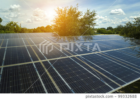 Aerial view of solar panels installed as shade roof over parking lot for parked cars for effective generation of clean electricity. Photovoltaic technology integrated in urban infrastructure 99332688