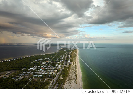 Aerial view of rich neighborhood with expensive vacation homes in Boca Grande, small town on Gasparilla Island in southwest Florida. American dream homes as example of real estate development in US Aerial view of rich neighborhood with expensive vacation homes in Boca Grande, small town on Gasparilla Island in southwest Florida. American dream homes as example of real estate development in US 99332719