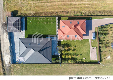 Aerial view of residential house with backyard in suburban rural area 99332732