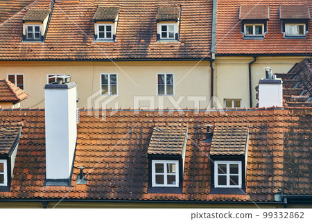 Two parallel tiled houses with orange roofs in Prague. Two parallel tiled houses with orange roofs in Prague. 99332862