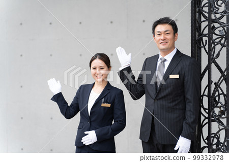 Concierge, hotel man, hotelier, wedding planner men and women in suits working at the hotel Concierge, hotel man, hotelier, wedding planner men and women in suits working at the hotel 99332978