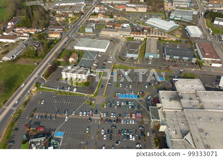 Aerial view of many colorful cars parked on parking lot with lines and markings for parking places and directions 99333071