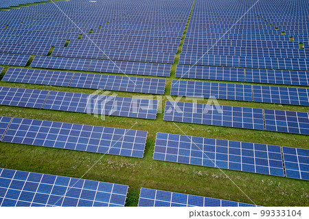 Aerial view of large sustainable electrical power plant with rows of solar photovoltaic panels for producing clean electric energy. Concept of renewable electricity with zero emission 99333104