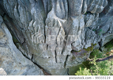 Aerial view of large rocky formations with snone boulders and mountain high cliffs 99333119