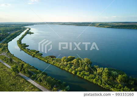 Aerial view of fish hetching pond with blue water in aquacultural area Aerial view of fish hetching pond with blue water in aquacultural area 99333160